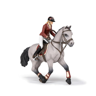 COMPETITION HORSE WITH RIDING GIRL