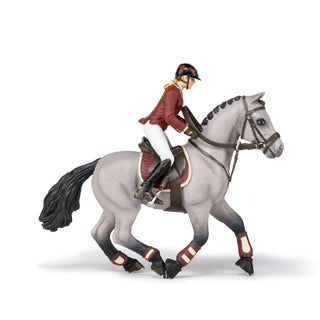 COMPETITION HORSE WITH RIDING GIRL